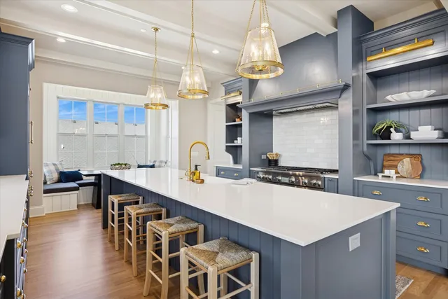a kitchen with a table and chairs in it
