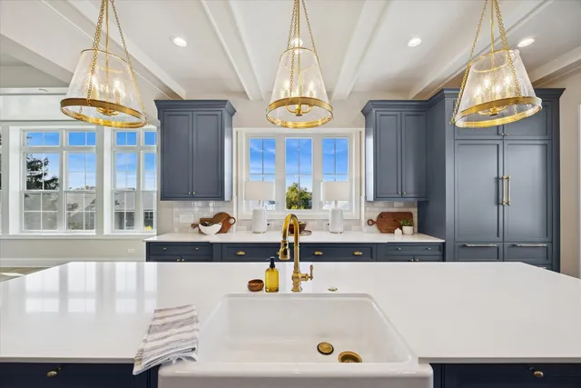 a kitchen with a sink a counter and cabinets
