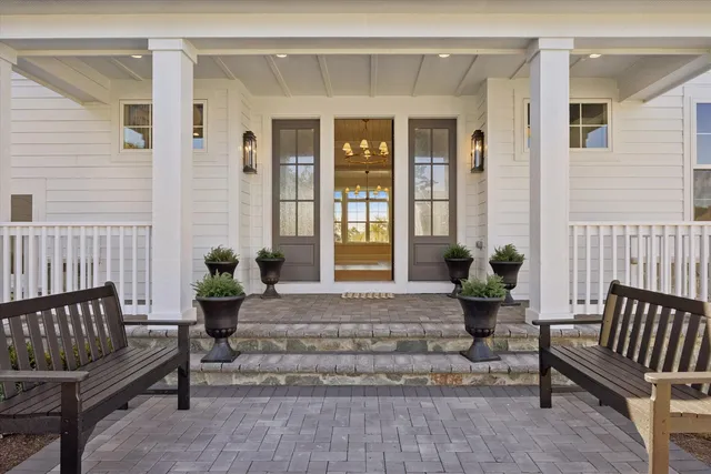 a view of a house with a bench in patio