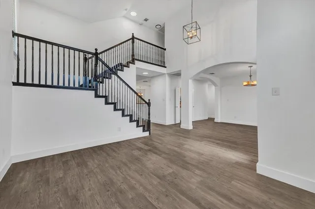 a bathroom with a double vanity sink toilet mirror and shower