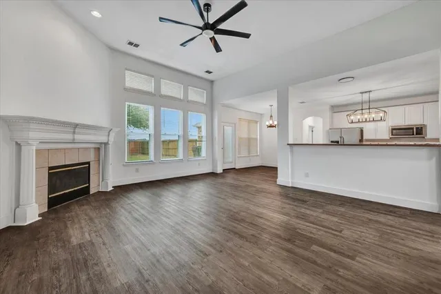 a kitchen with kitchen island a sink and wooden floor