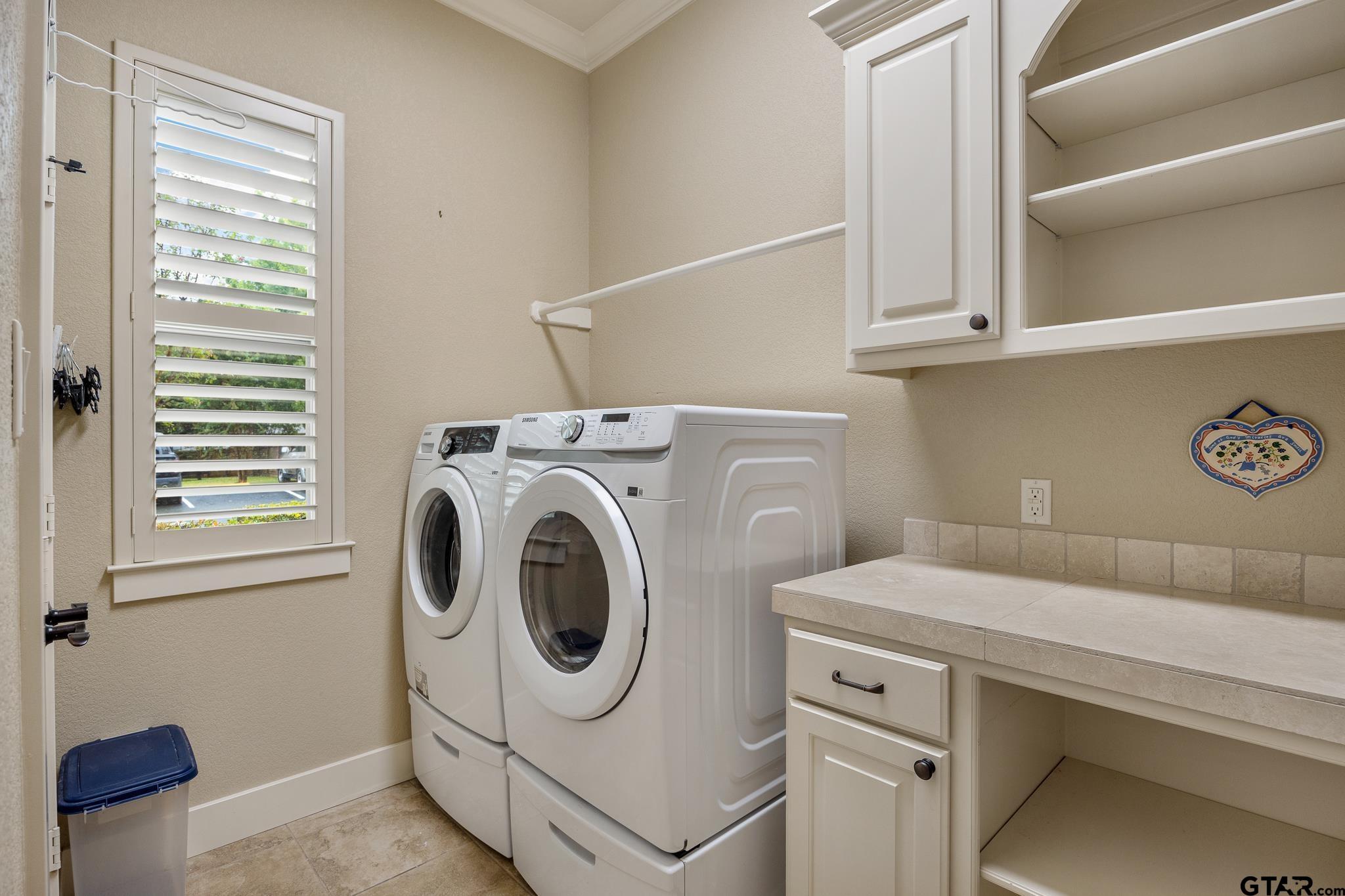 4322 Madera Drive Tyler, TX 75707 - Photo 14 of 32 a utility room with dryer and washer