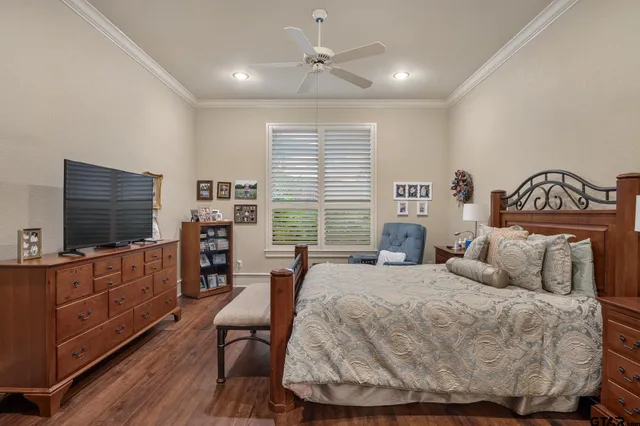 a bedroom with a bed and a desk