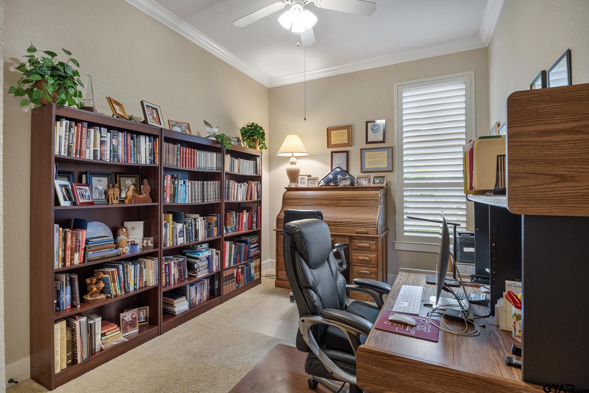 4322 Madera Drive Tyler, TX 75707 - Photo 25 of 32 a view of a workspace with bookshelf and a window