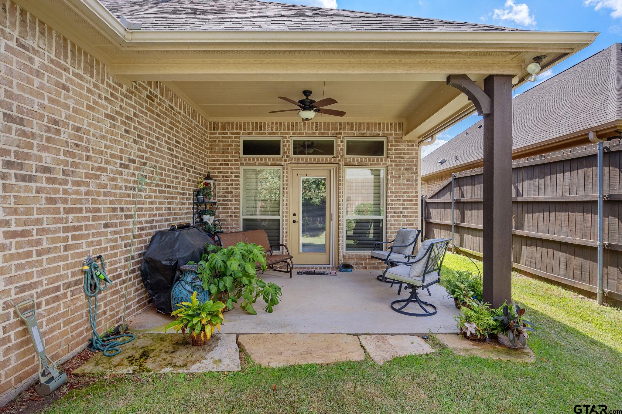 4322 Madera Drive Tyler, TX 75707 - Photo 29 of 32 a view of a porch with chairs and potted plants
