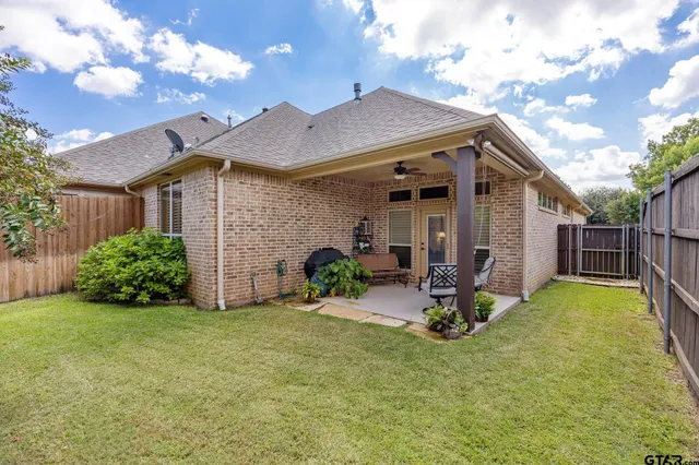 a view of backyard with seating space