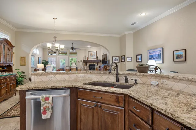 a kitchen with sink and cabinets