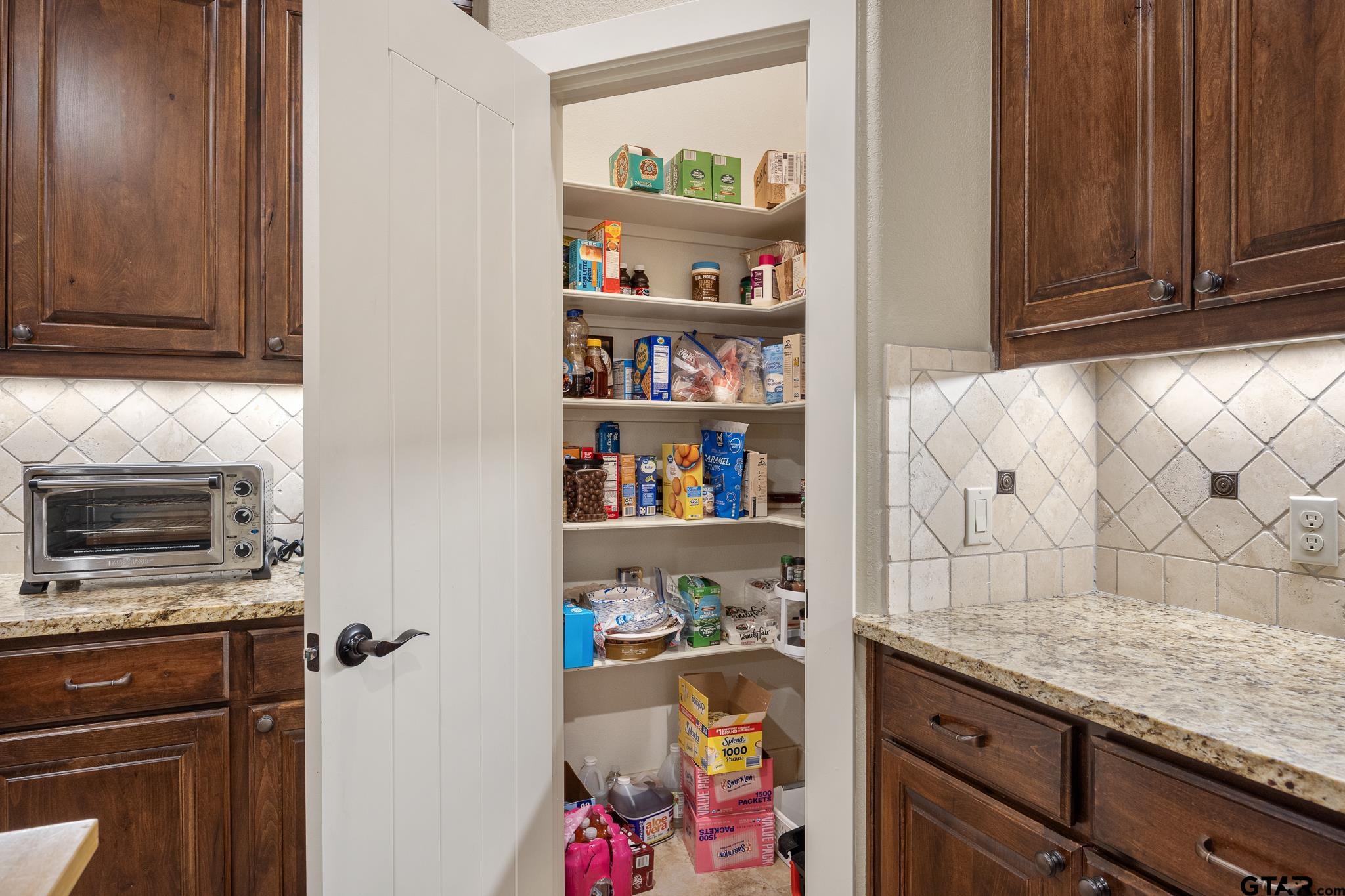 4322 Madera Drive Tyler, TX 75707 - Photo 10 of 32 a kitchen with a cabinets and window