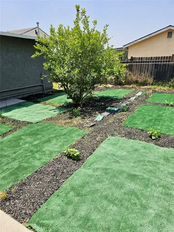 a backyard of a house with lots of green space