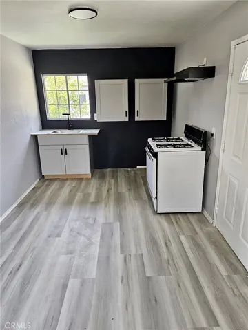 a living room with a couch and a dresser