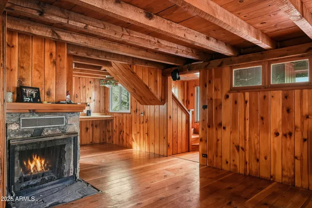 a view of a kitchen with furniture and a fireplace