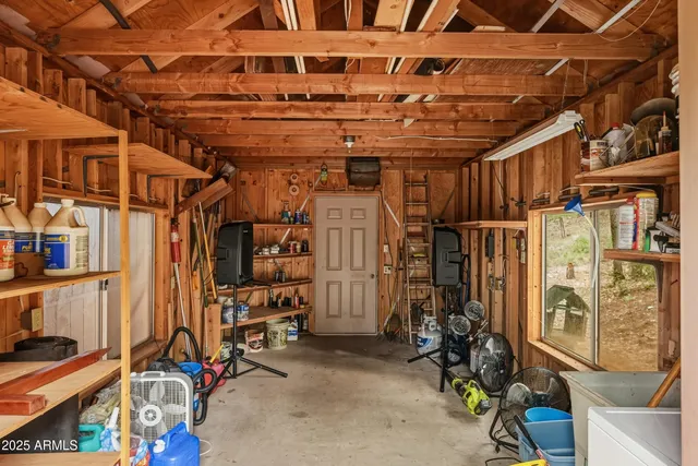 an aerial view of a residential houses with yard