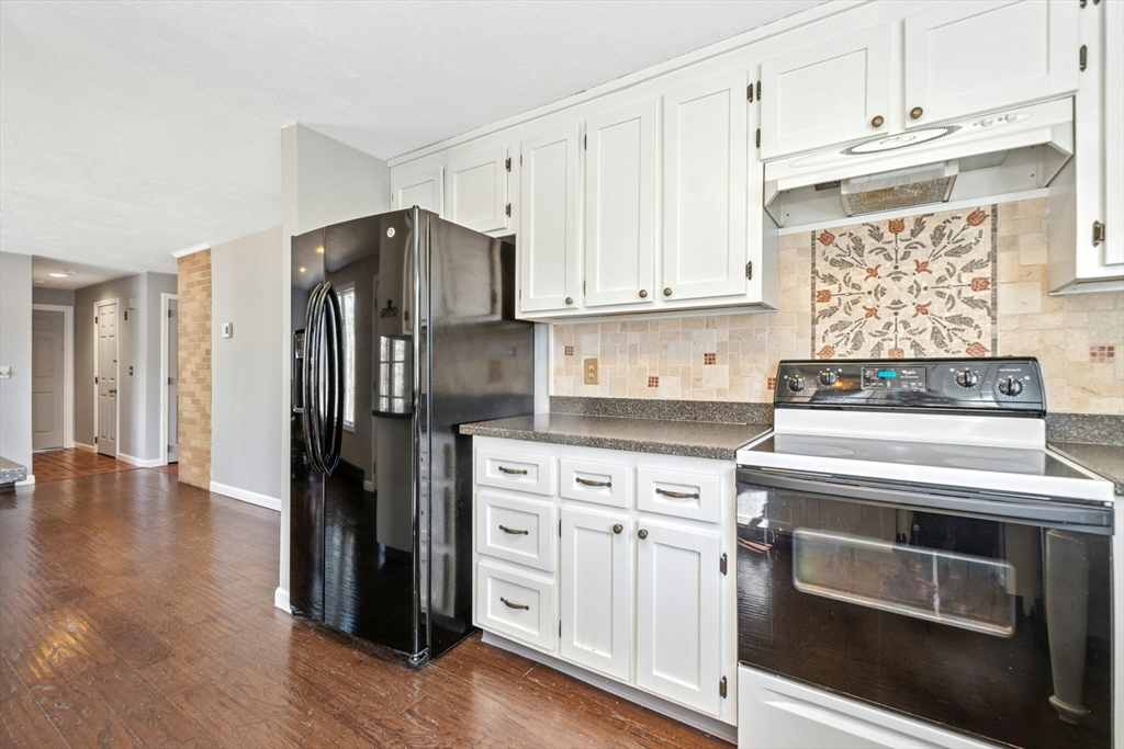 58 South Mill Street Hopkinton, MA 01748 - Photo 11 of 34 a kitchen with cabinets and stainless steel appliances