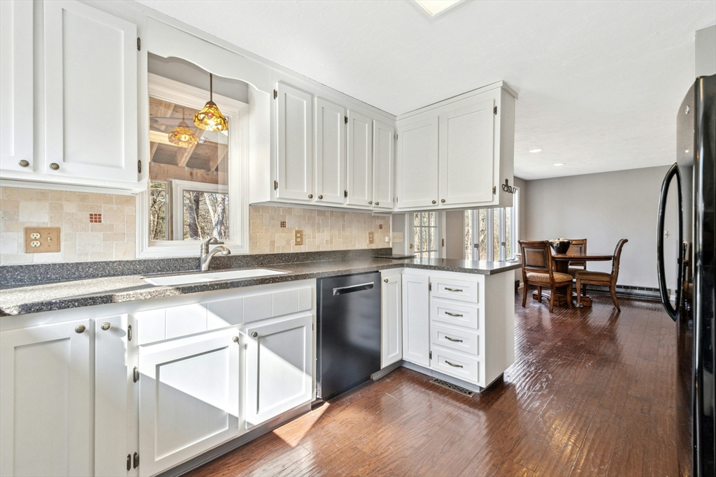 58 South Mill Street Hopkinton, MA 01748 - Photo 12 of 34 a kitchen with white cabinets and white appliances