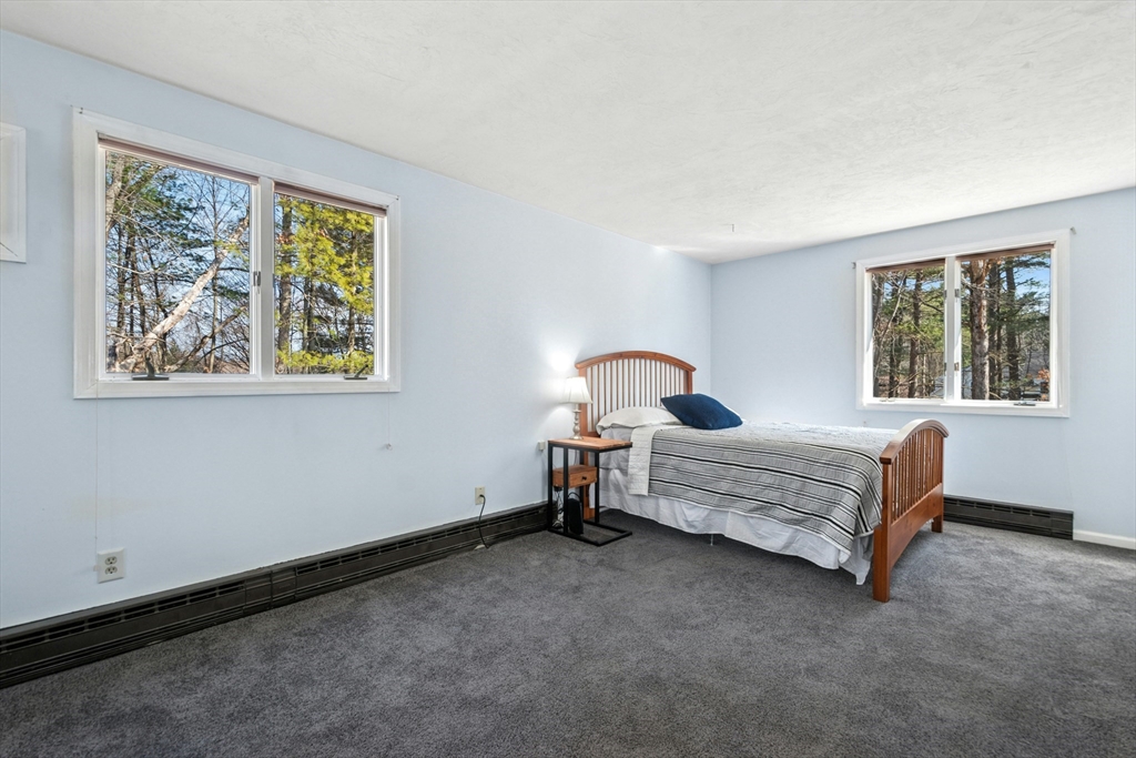 58 South Mill Street Hopkinton, MA 01748 - Photo 13 of 34 a bedroom with a bed and a window