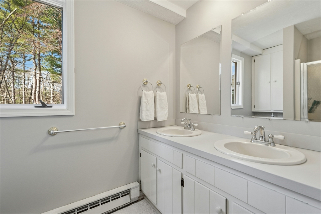 58 South Mill Street Hopkinton, MA 01748 - Photo 14 of 34 a bathroom with a sink and a mirror