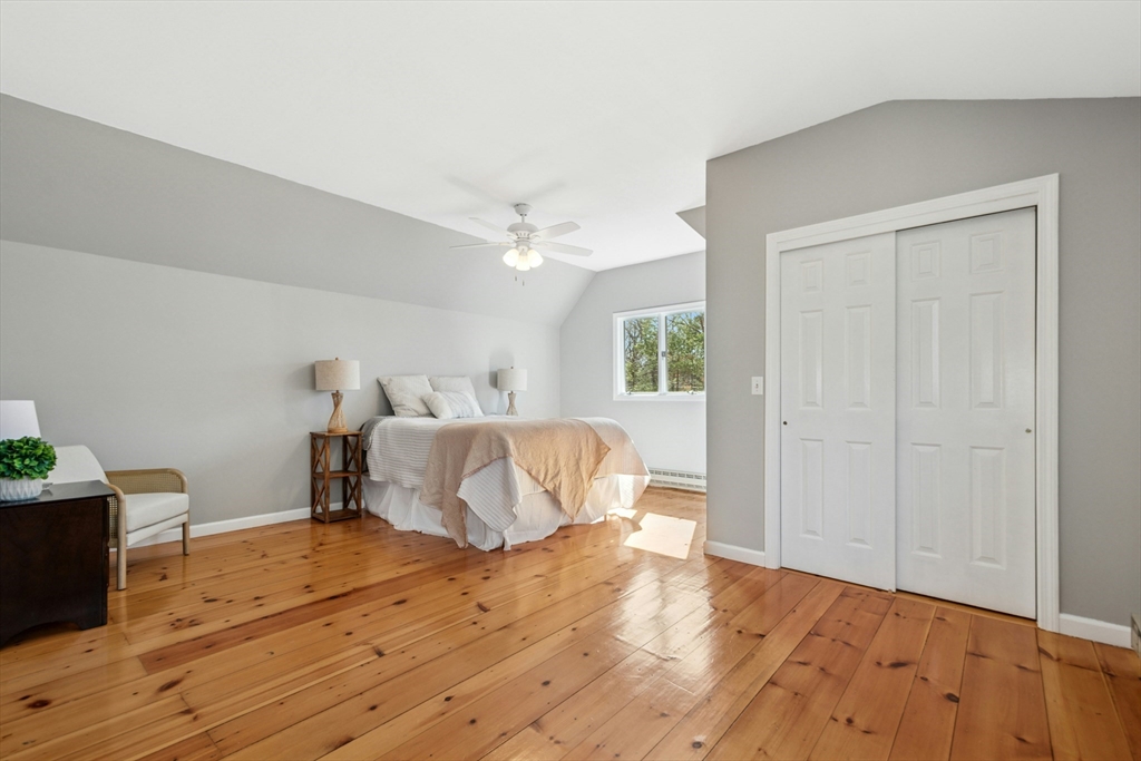 58 South Mill Street Hopkinton, MA 01748 - Photo 15 of 34 a bedroom with a bed and wooden floor