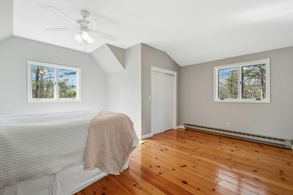 58 South Mill Street Hopkinton, MA 01748 - Photo 16 of 34 a bedroom with a bed and a painting on the wall