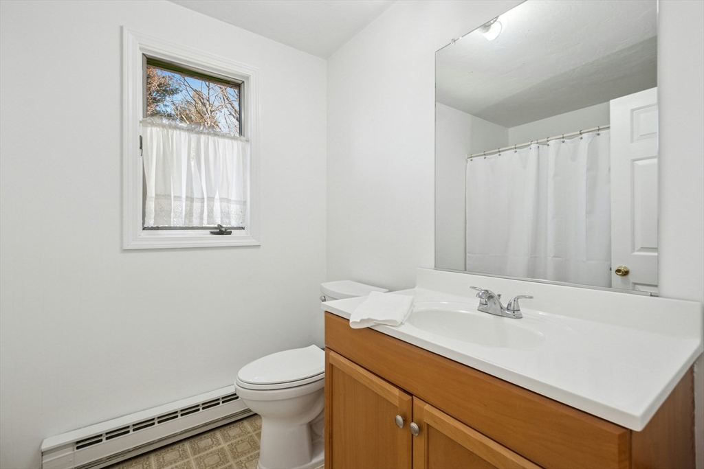 58 South Mill Street Hopkinton, MA 01748 - Photo 18 of 34 a bathroom with a sink toilet and vanity