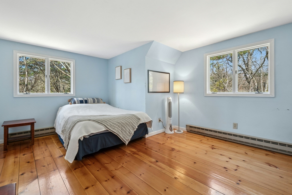 58 South Mill Street Hopkinton, MA 01748 - Photo 19 of 34 a bedroom with a bed and a painting on the wall