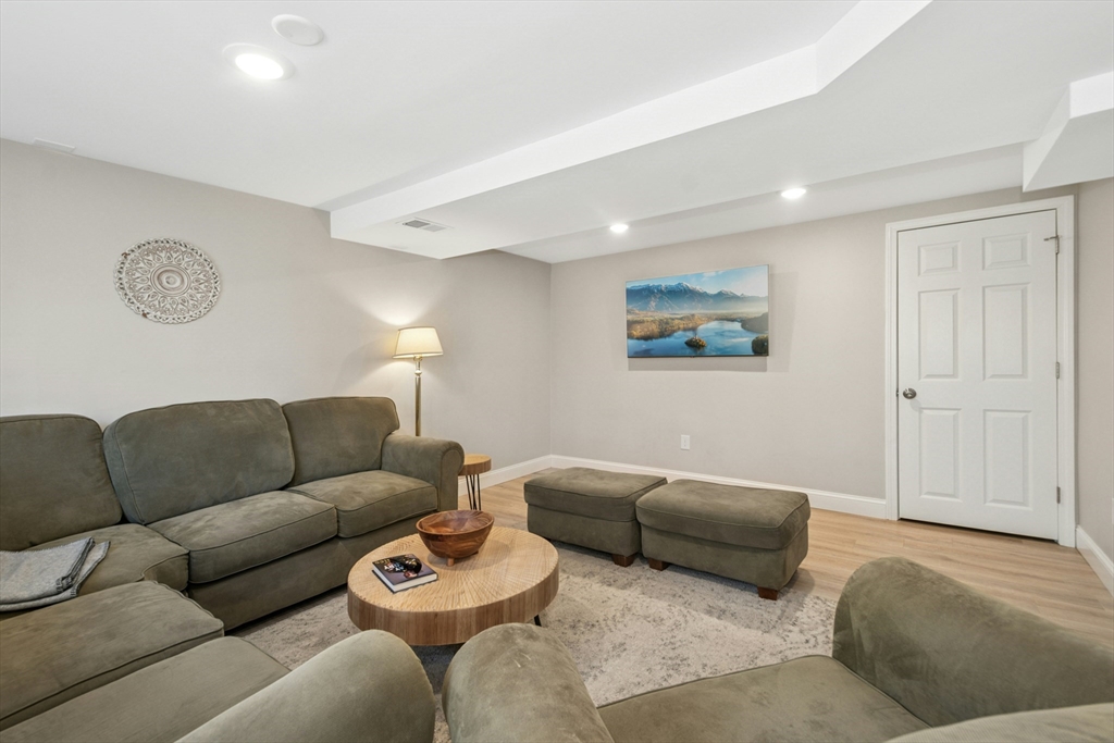 58 South Mill Street Hopkinton, MA 01748 - Photo 23 of 34 a living room with furniture a couch and dresser