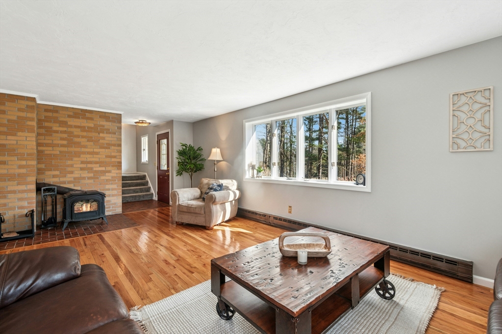 58 South Mill Street Hopkinton, MA 01748 - Photo 5 of 34 a living room with furniture and a fireplace