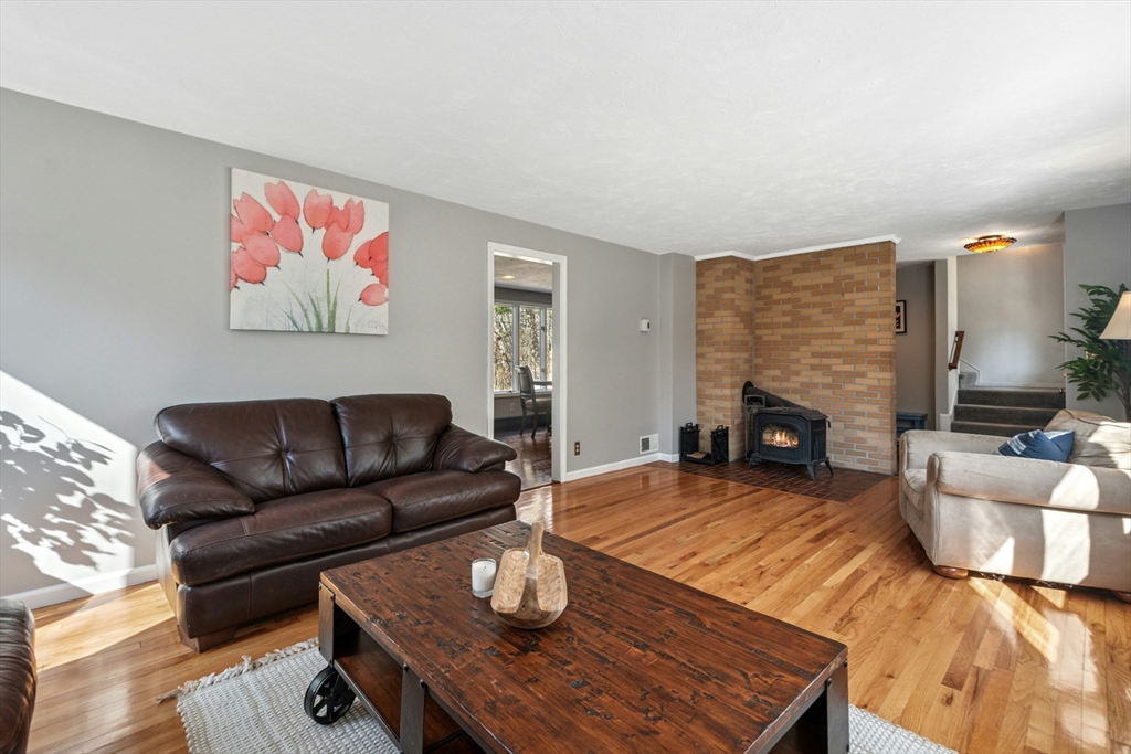 58 South Mill Street Hopkinton, MA 01748 - Photo 6 of 34 a living room with furniture and a fireplace
