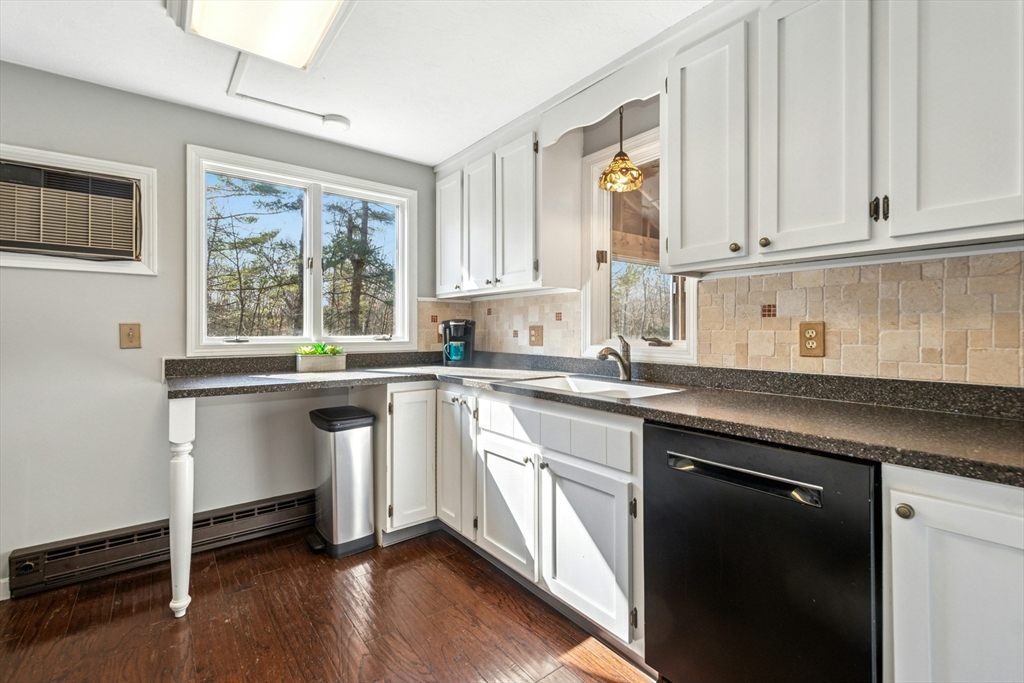 58 South Mill Street Hopkinton, MA 01748 - Photo 9 of 34 a kitchen with granite countertop white cabinets and white appliances