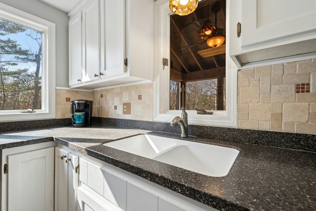 58 South Mill Street Hopkinton, MA 01748 - Photo 10 of 34 a kitchen with granite countertop a sink and a stove