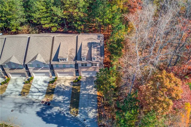 a view of swimming pool with outdoor seating and plants