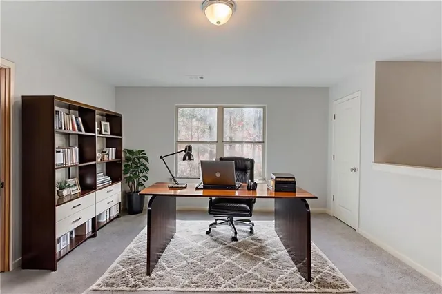 a workspace with furniture and window