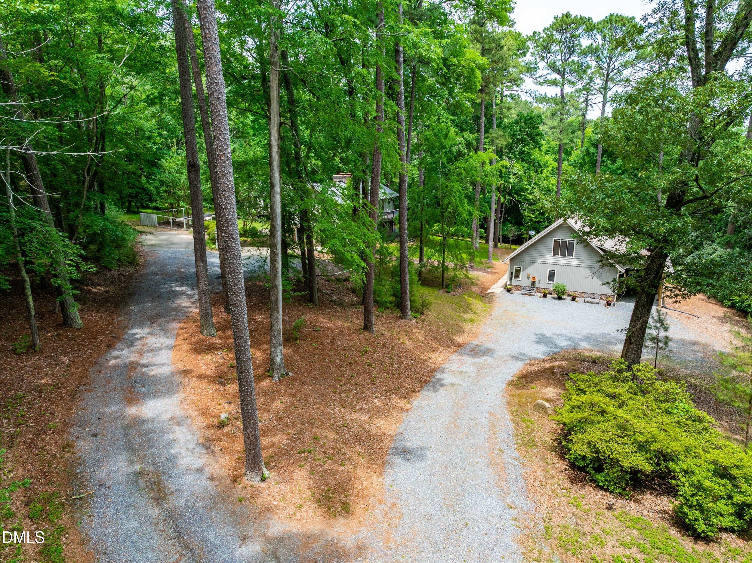 104 Tripp Road Pittsboro, NC 27312 - Photo 3 of 49 03_arrival-driveway-setting