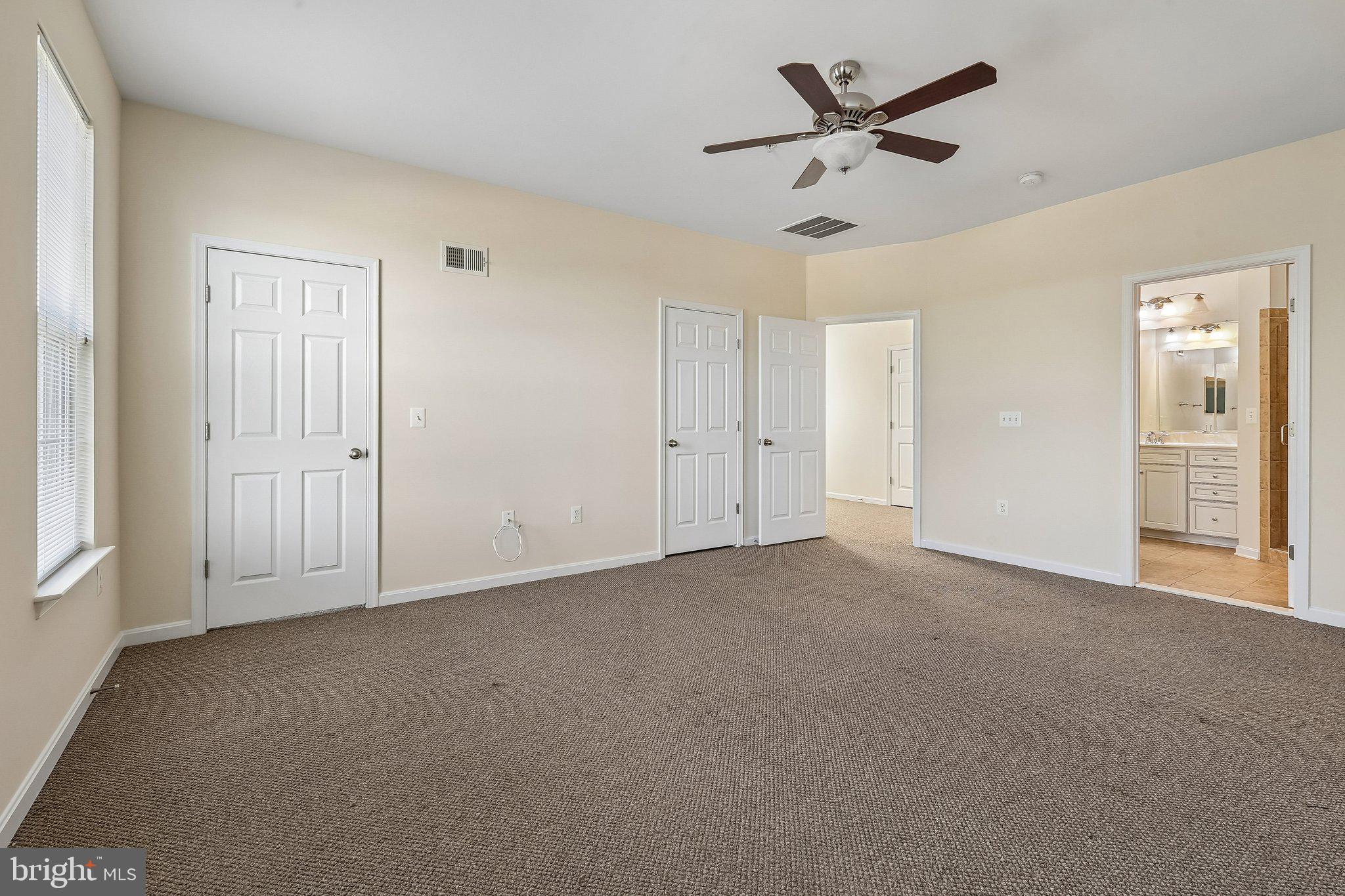9581 Center Street Manassas, VA 20110 - Photo 17 of 25 an empty room with ceiling fan and window