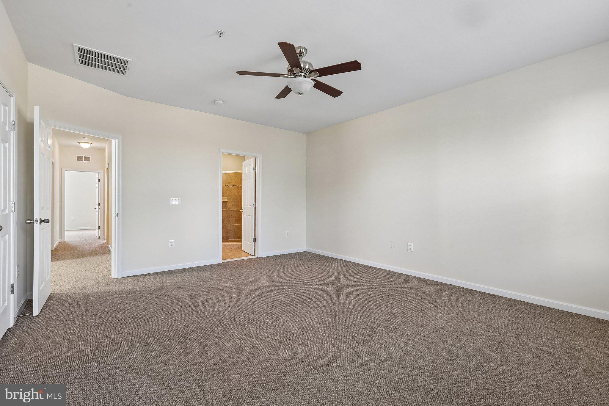 9581 Center Street Manassas, VA 20110 - Photo 18 of 25 an empty room with closet and windows