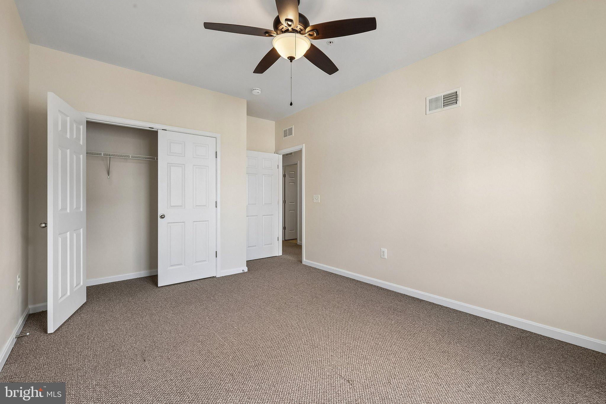 9581 Center Street Manassas, VA 20110 - Photo 20 of 25 an empty room with chandelier fan