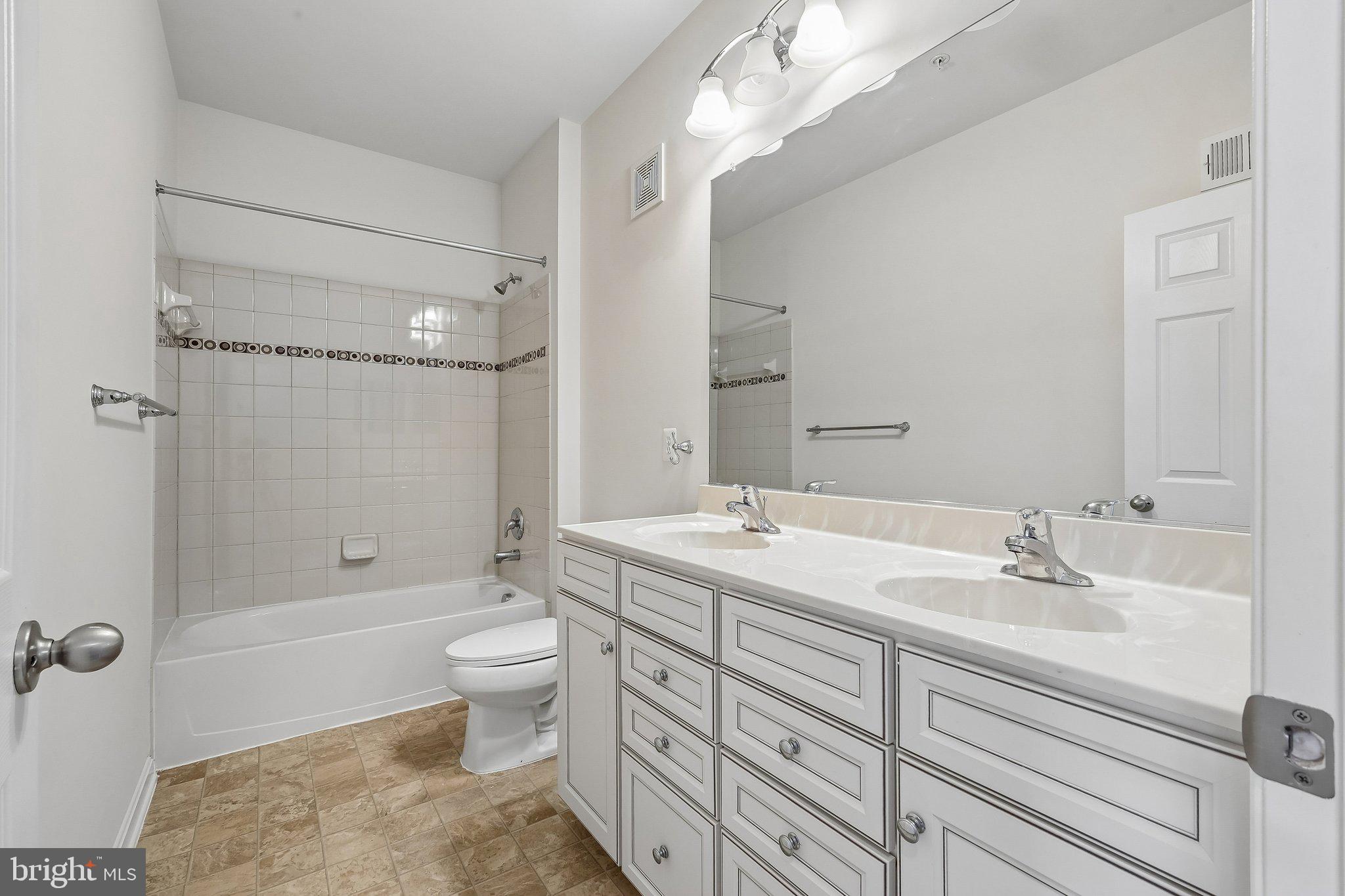 9581 Center Street Manassas, VA 20110 - Photo 21 of 25 a bathroom with a sink a toilet and shower