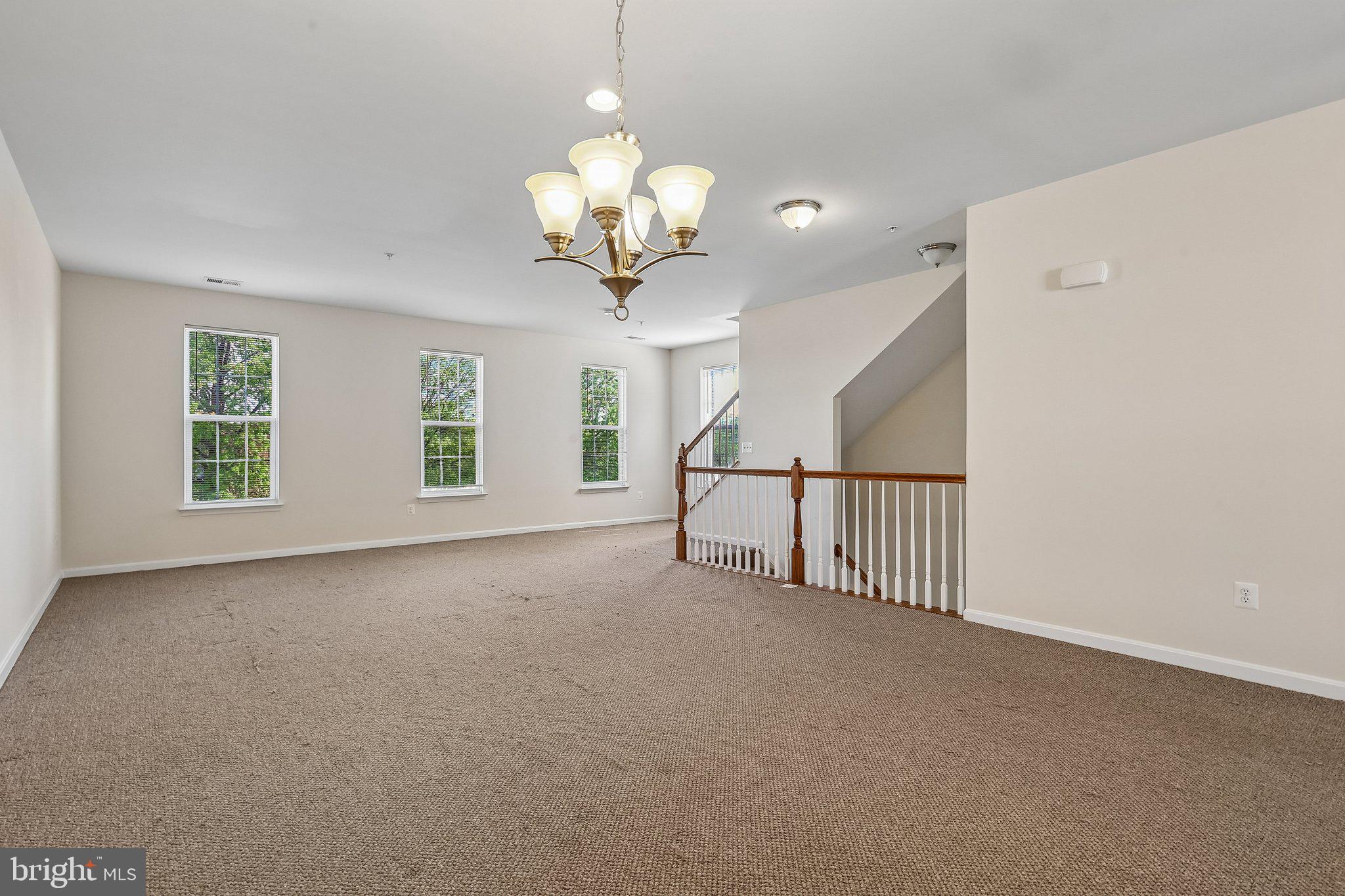 9581 Center Street Manassas, VA 20110 - Photo 4 of 25 a view of a livingroom with a chandelier fan
