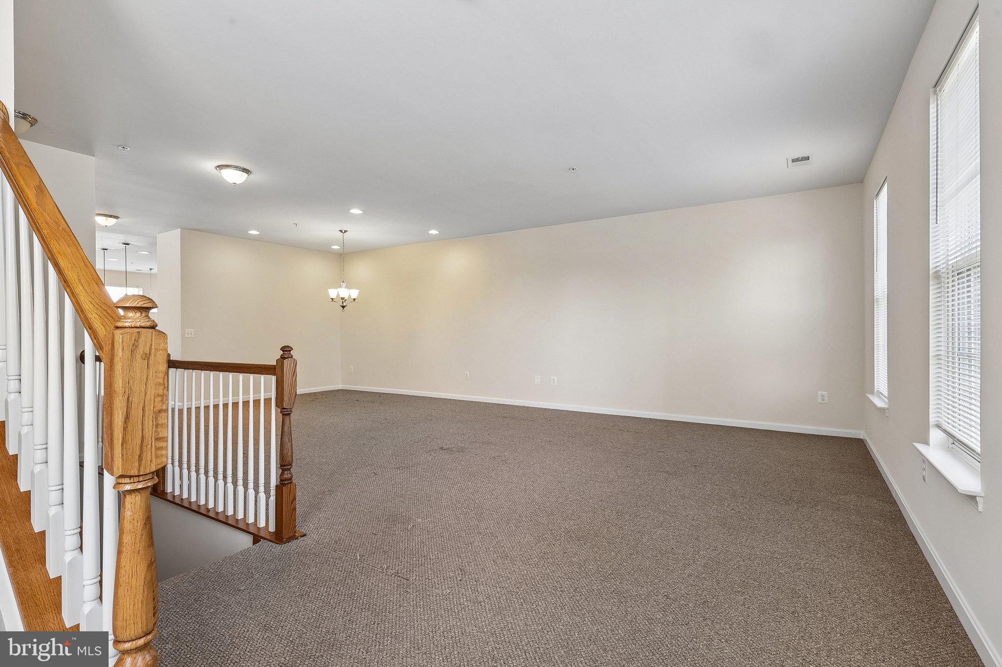 9581 Center Street Manassas, VA 20110 - Photo 5 of 25 an empty room with staircase