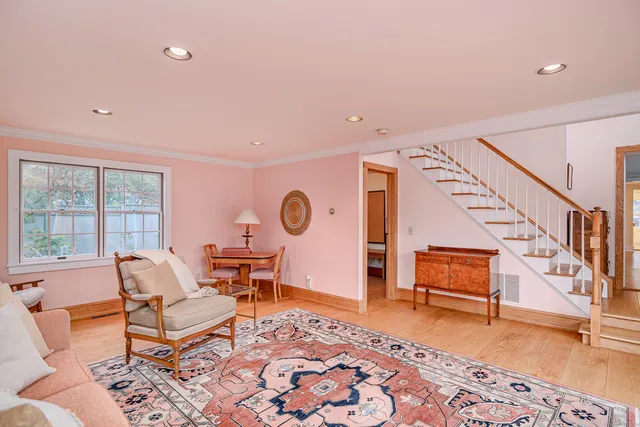 a living room with furniture and a rug