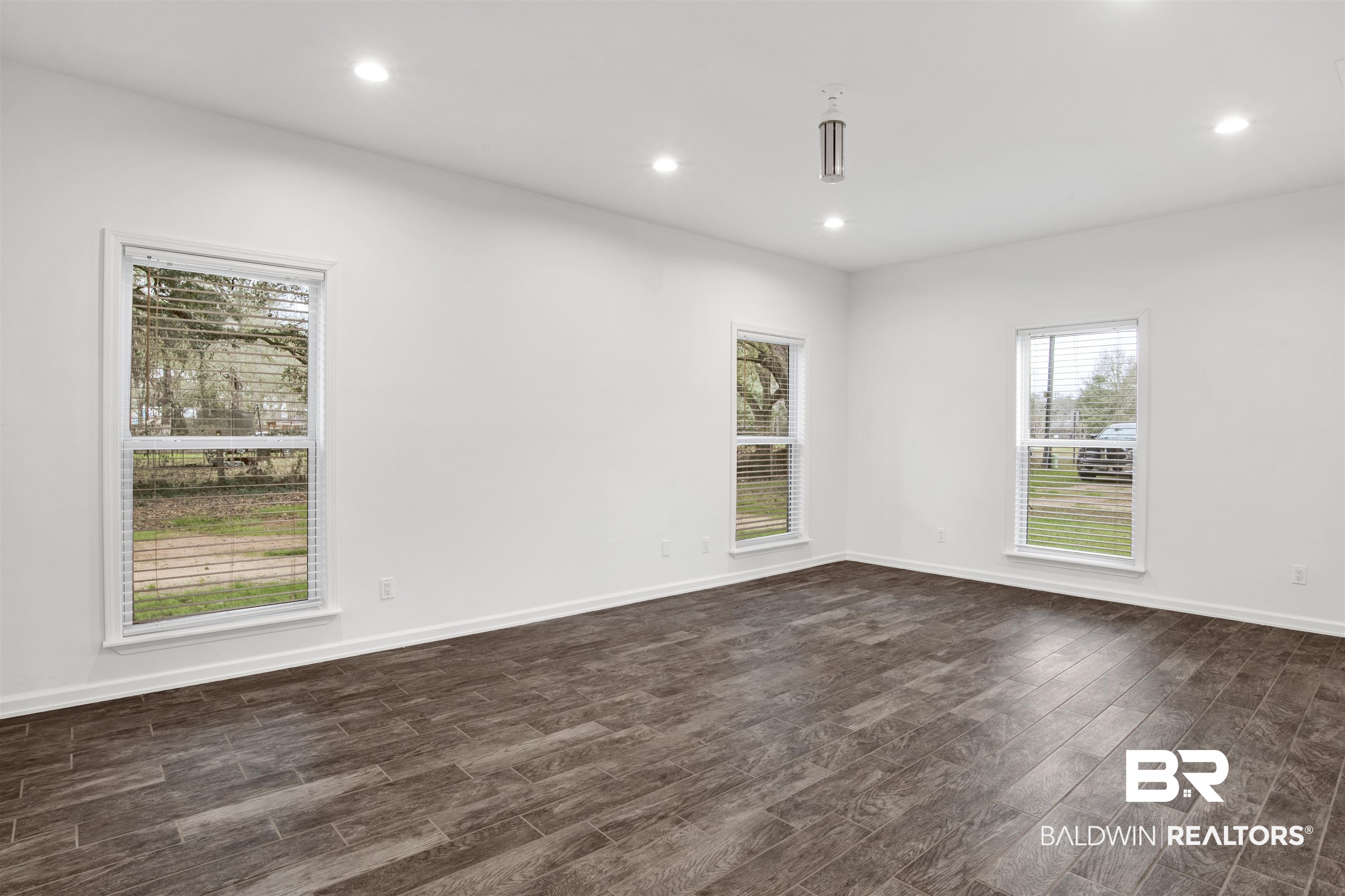 10871 Somerset Road Grand Bay, AL 36541 - Photo 8 of 31 Unfurnished room featuring dark wood-type flooring