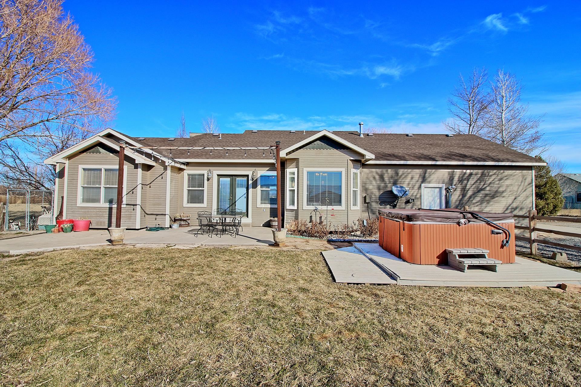 1885 J Road Fruita, CO 81521 - Photo 5 of 41 front view of a house with a patio