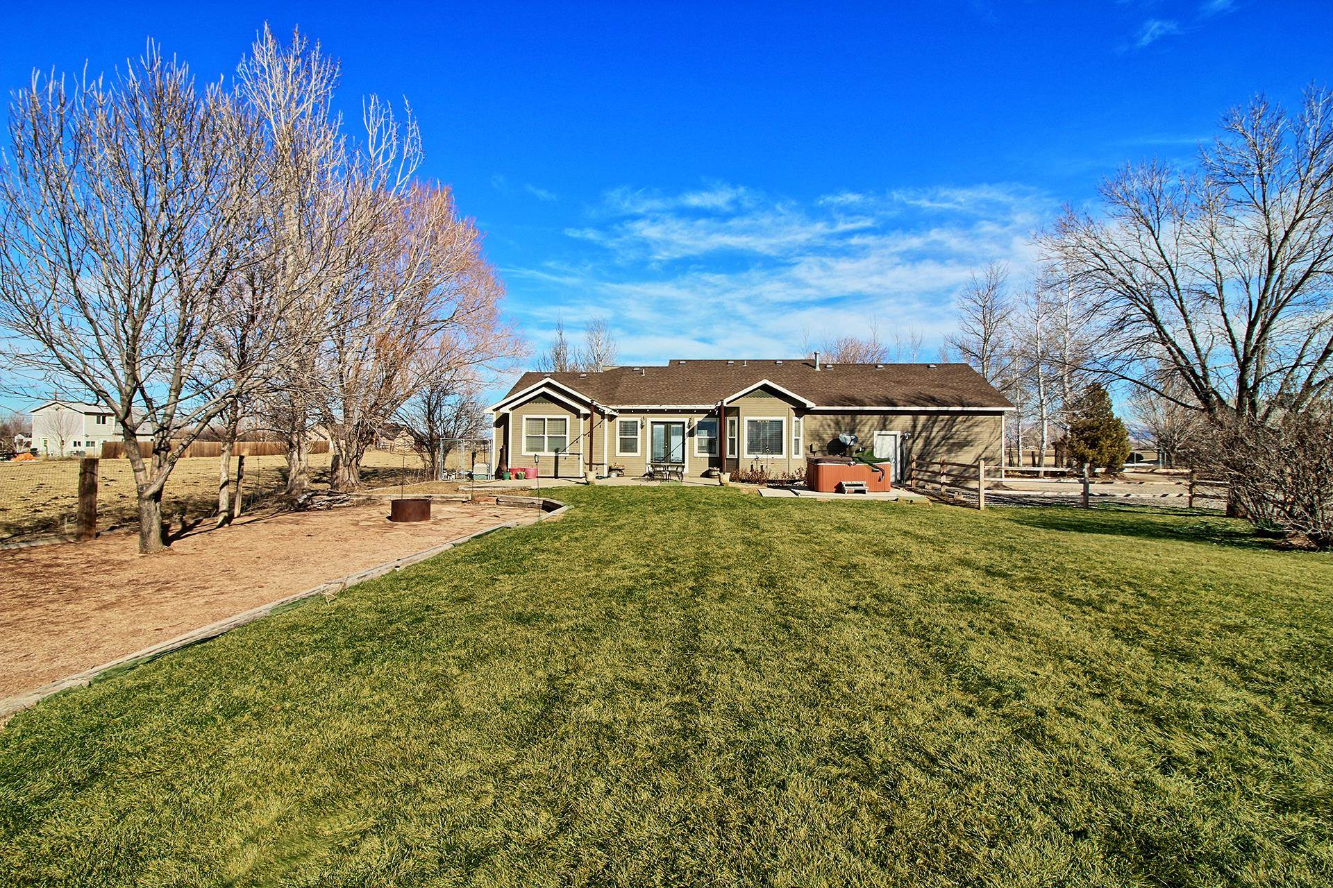 1885 J Road Fruita, CO 81521 - Photo 8 of 41 a view of houses with yard