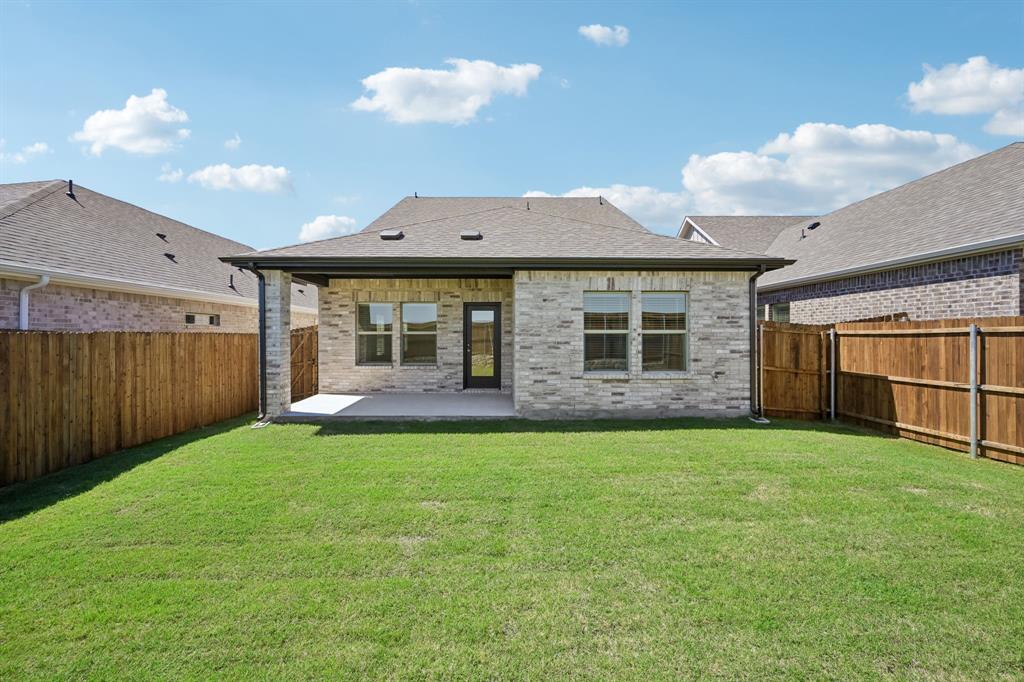 1705 Arches Road Anna, TX 75409 - Photo 32 of 33 a view of a house with backyard and a garden