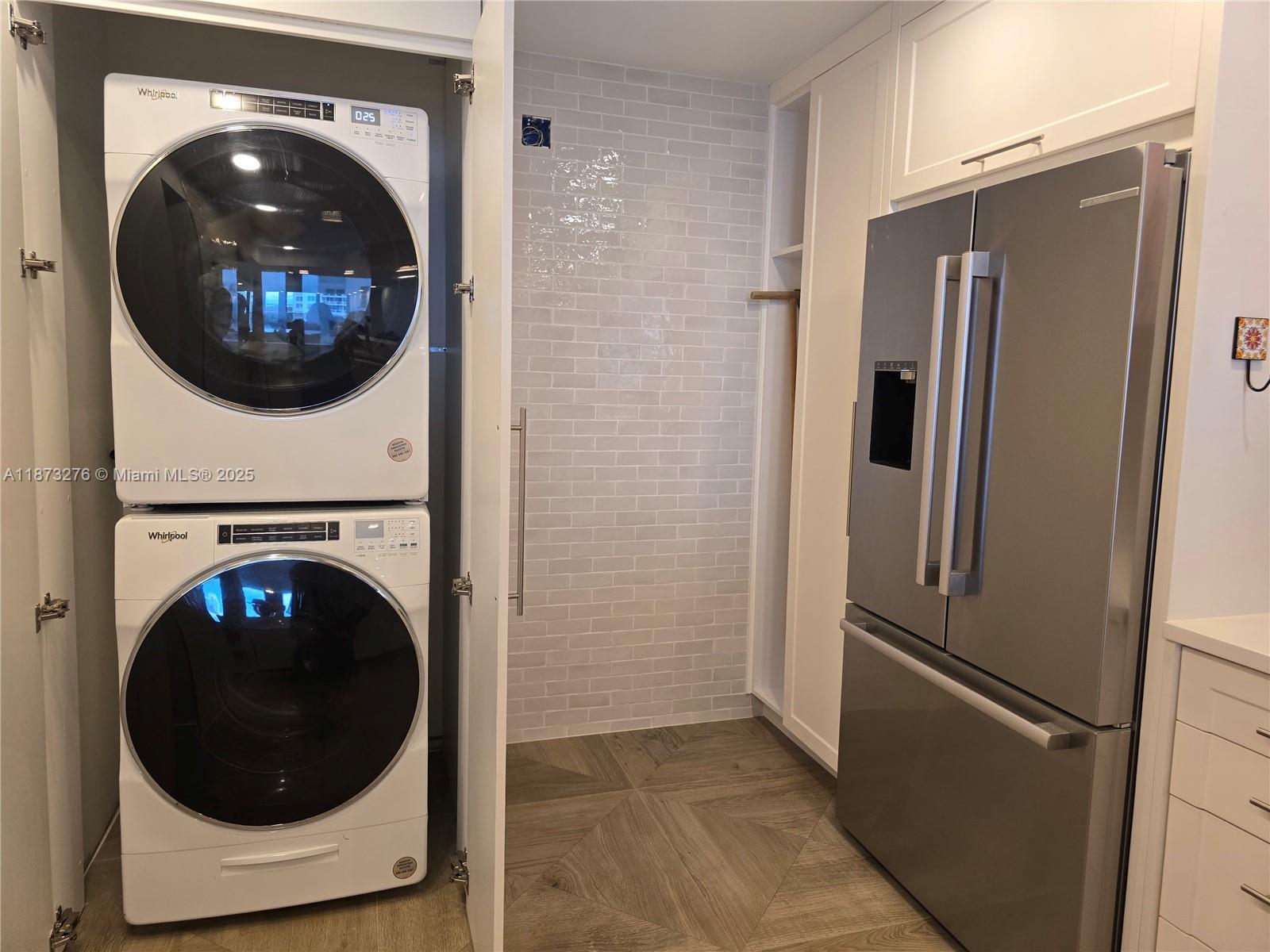 Millionaire's Row Miami Beach, FL 33140 - Photo 11 of 34 a view of a kitchen with a washer and dryer