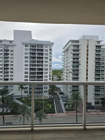 a view of a balcony with sitting area