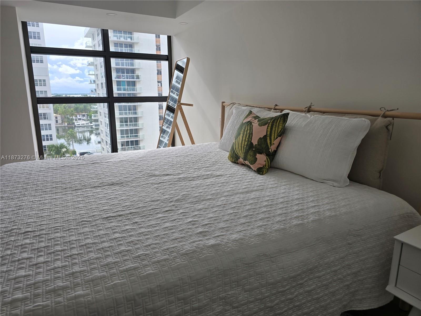 Millionaire's Row Miami Beach, FL 33140 - Photo 15 of 34 a bedroom with a bed and window