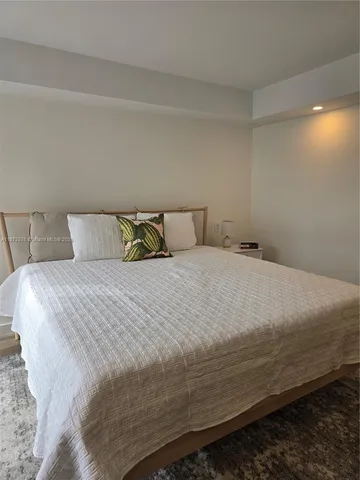 a bedroom with a bed and closet