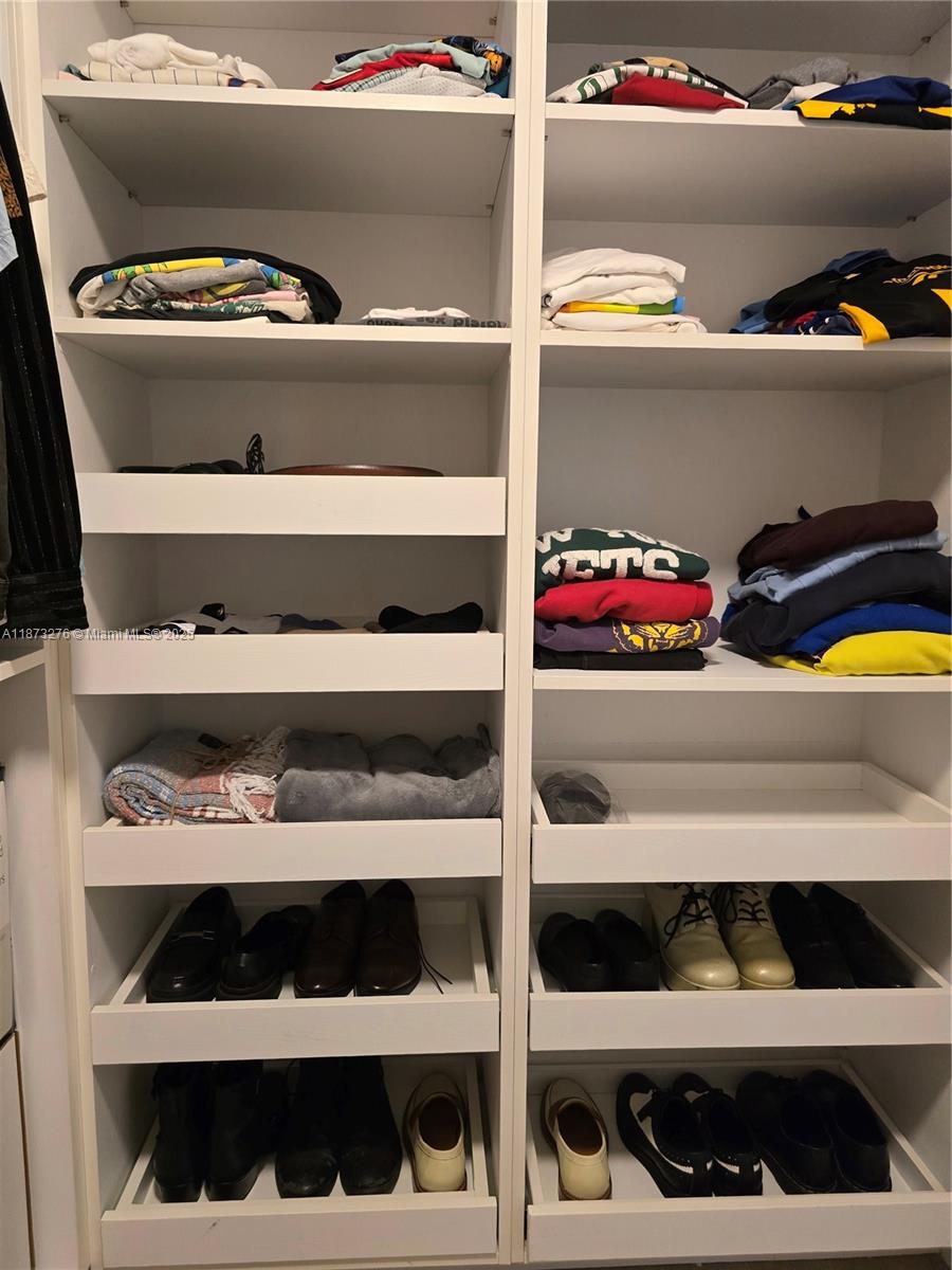 Millionaire's Row Miami Beach, FL 33140 - Photo 18 of 34 a view of walk in closet with clothes and shoes