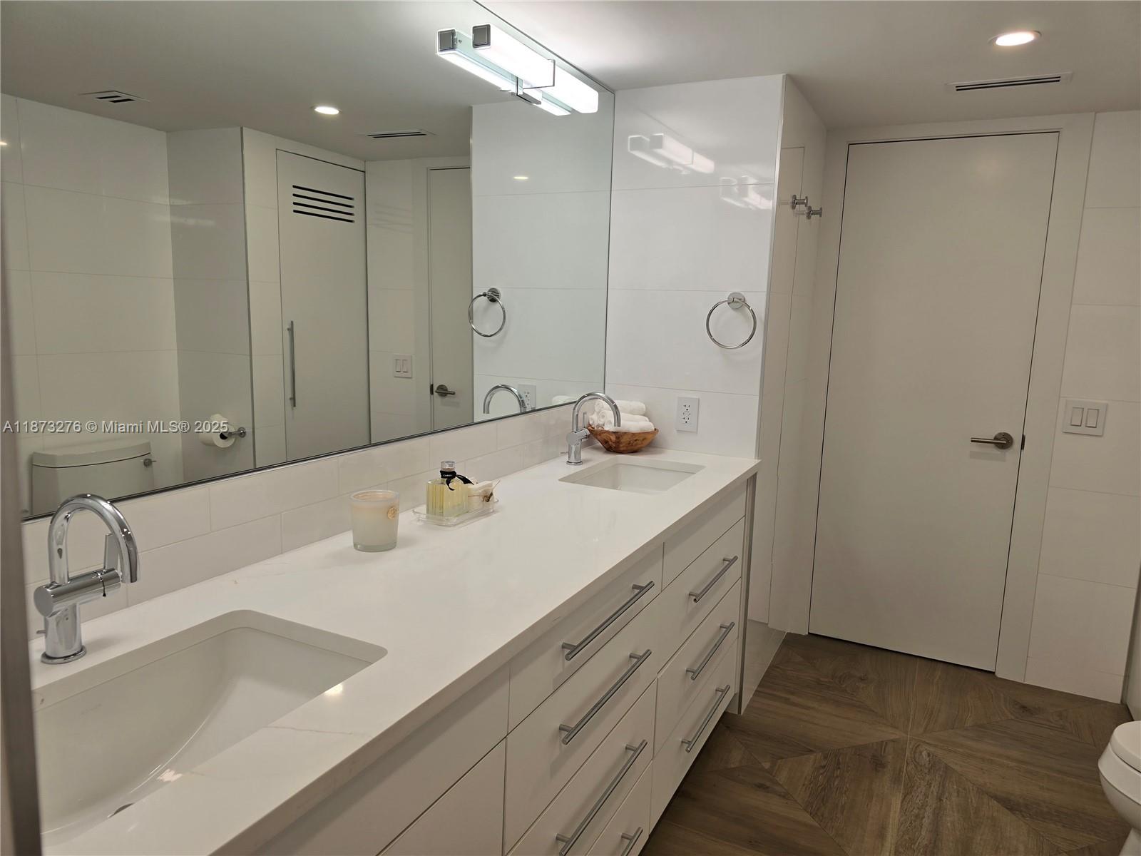 Millionaire's Row Miami Beach, FL 33140 - Photo 19 of 34 a bathroom with a double vanity sink mirror and double