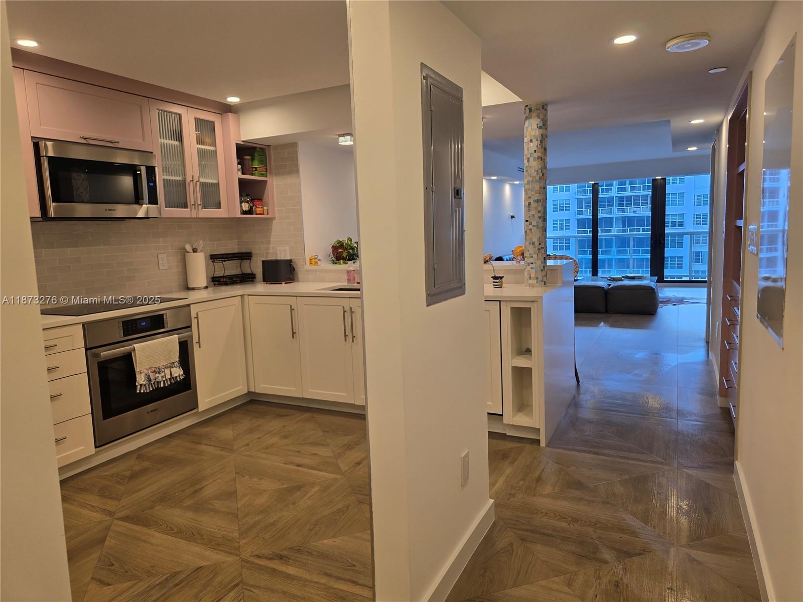Millionaire's Row Miami Beach, FL 33140 - Photo 2 of 34 a kitchen with stainless steel appliances granite countertop a refrigerator and a stove top oven